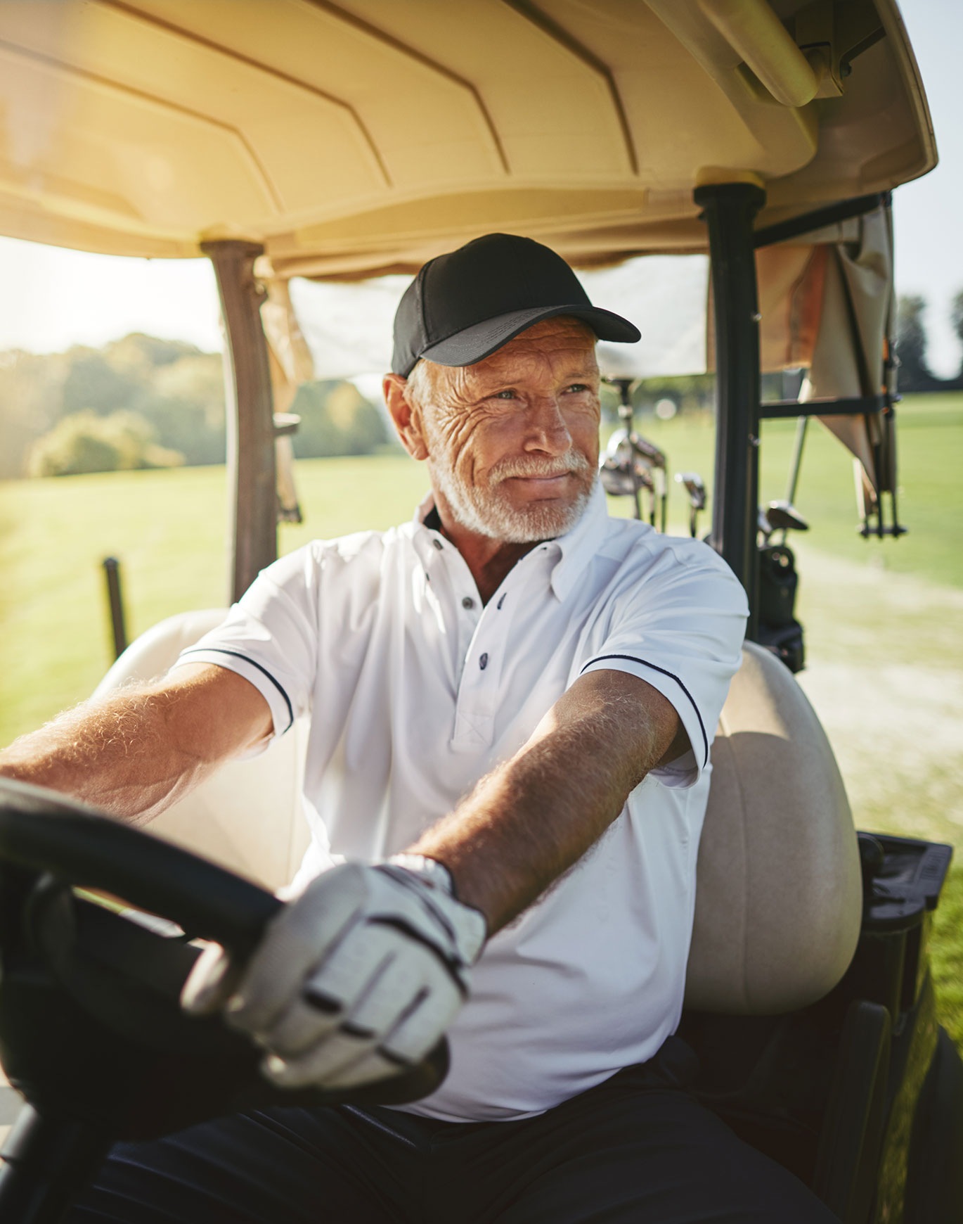 older gentleman in golf cart